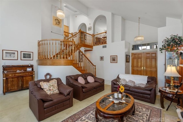 29206 Alfieri St, Laguna Niguel, CA 92677 - living room with high vaulted ceiling, stairway, and carpet flooring