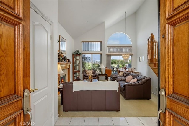 29206 Alfieri St, Laguna Niguel, CA 92677 - living room with healthy amount of natural light, light tile patterned flooring, light carpet, high vaulted ceiling, and a glass covered fireplace