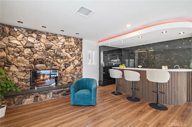 5742 Thelma Ave, La Palma, CA 90623 - kitchen with a fireplace, wood finished floors, and recessed lighting