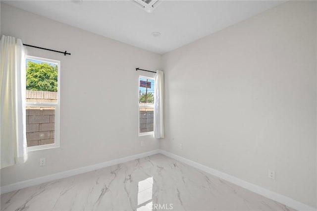 5742 Thelma Ave, La Palma, CA 90623 - spare room with marble look tile flooring, plenty of natural light, and baseboards