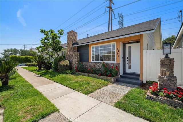 5742 Thelma Ave, La Palma, CA 90623 - view of front of home with a chimney and a shingled roof