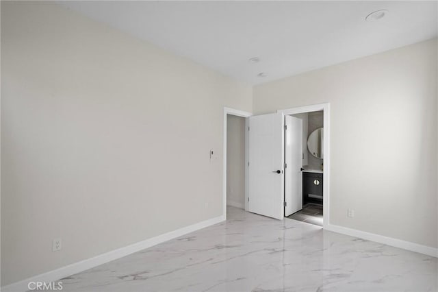 5742 Thelma Ave, La Palma, CA 90623 - unfurnished bedroom featuring light marble finish floors, baseboards, and ensuite bath