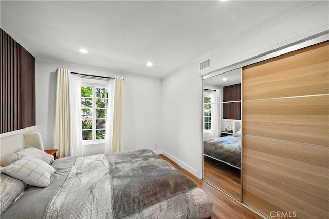 5742 Thelma Ave, La Palma, CA 90623 - bedroom with wood finished floors, multiple windows, ornamental molding, recessed lighting, and baseboards