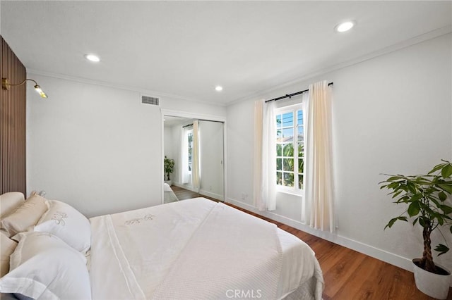 5742 Thelma Ave, La Palma, CA 90623 - bedroom with wood finished floors, baseboards, crown molding, recessed lighting, and a closet