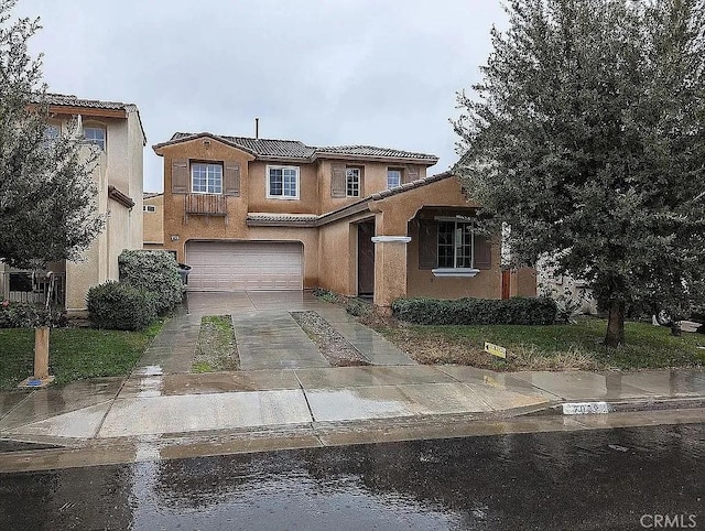 3929 Albillo, Perris, CA 92571 - view of front facade with concrete driveway, an attached garage, a tiled roof, and stucco siding