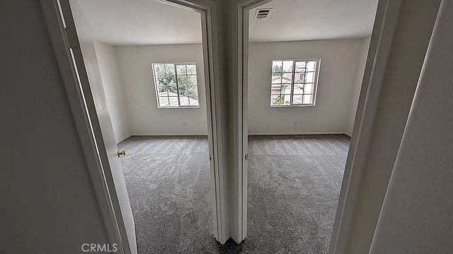 3929 Albillo, Perris, CA 92571 - carpeted empty room featuring baseboards