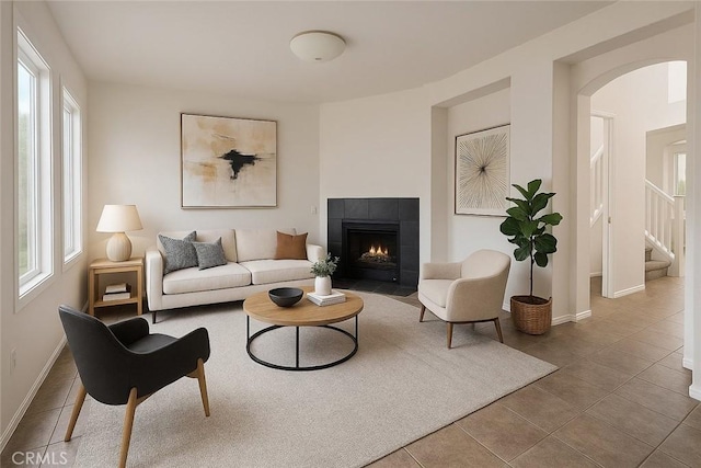 3929 Albillo, Perris, CA 92571 - living area with tile patterned flooring, a fireplace, baseboards, and stairs
