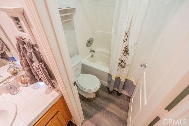 36884 Hidden Trail Ct, Winchester, CA 92596 - bathroom with wood finished floors, shower / tub combo with curtain, toilet, and vanity