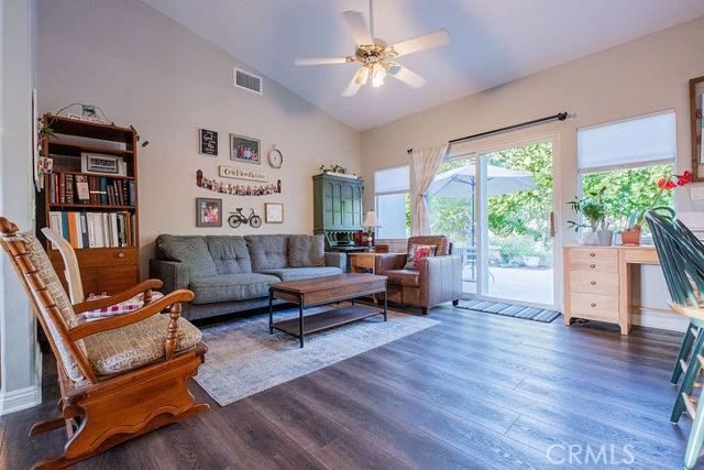 36884 Hidden Trail Ct, Winchester, CA 92596 - living area featuring dark wood-style floors, a ceiling fan, and high vaulted ceiling