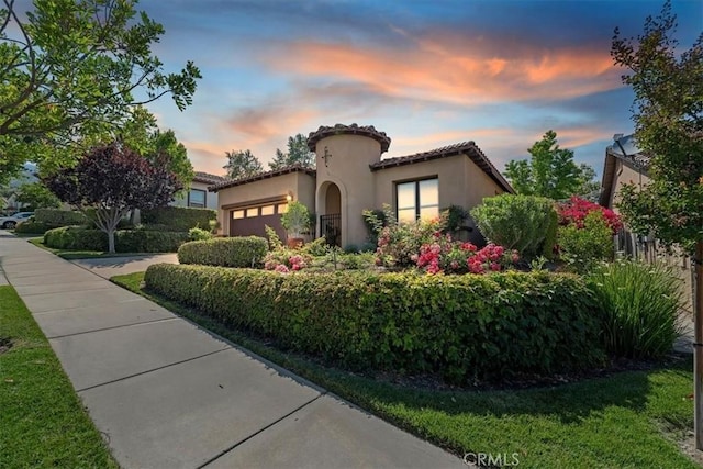24271 Whitetail Dr, Corona, CA 92883 - mediterranean / spanish-style house with a garage, a tiled roof, stucco siding, and driveway