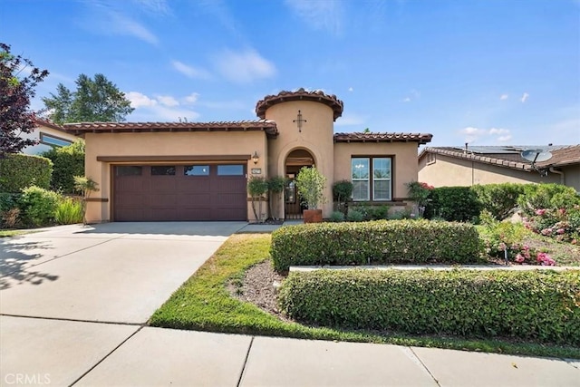 24271 Whitetail Dr, Corona, CA 92883 - mediterranean / spanish-style house featuring a garage, concrete driveway, stucco siding, and a tile roof