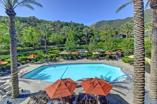 24271 Whitetail Dr, Corona, CA 92883 - community pool featuring a patio area and a mountain view