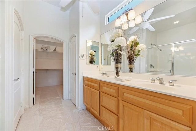 24271 Whitetail Dr, Corona, CA 92883 - full bath featuring ceiling fan, a shower stall, double vanity, and marble look tile flooring