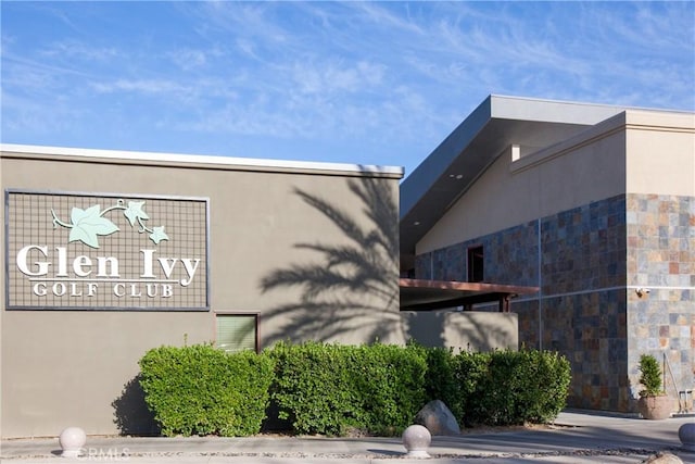 24271 Whitetail Dr, Corona, CA 92883 - view of side of home featuring stucco siding