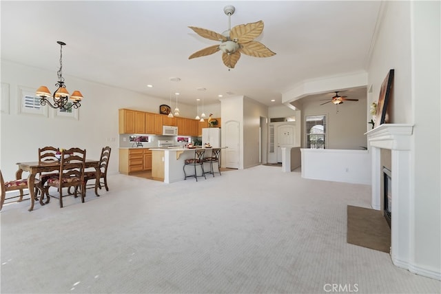 24271 Whitetail Dr, Corona, CA 92883 - living room featuring light carpet, ceiling fan, a chandelier, recessed lighting, and ornamental molding