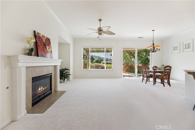 24271 Whitetail Dr, Corona, CA 92883 - carpeted living room featuring crown molding, a chandelier, and a tiled fireplace
