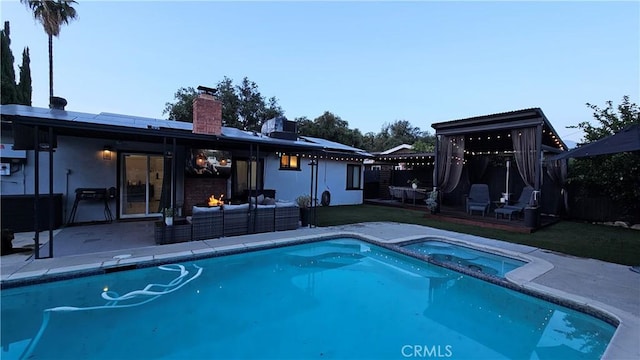 402 Hartzell Ave, Redlands, CA 92374 - view of pool featuring an outdoor hangout area, a patio, and a pool with connected hot tub