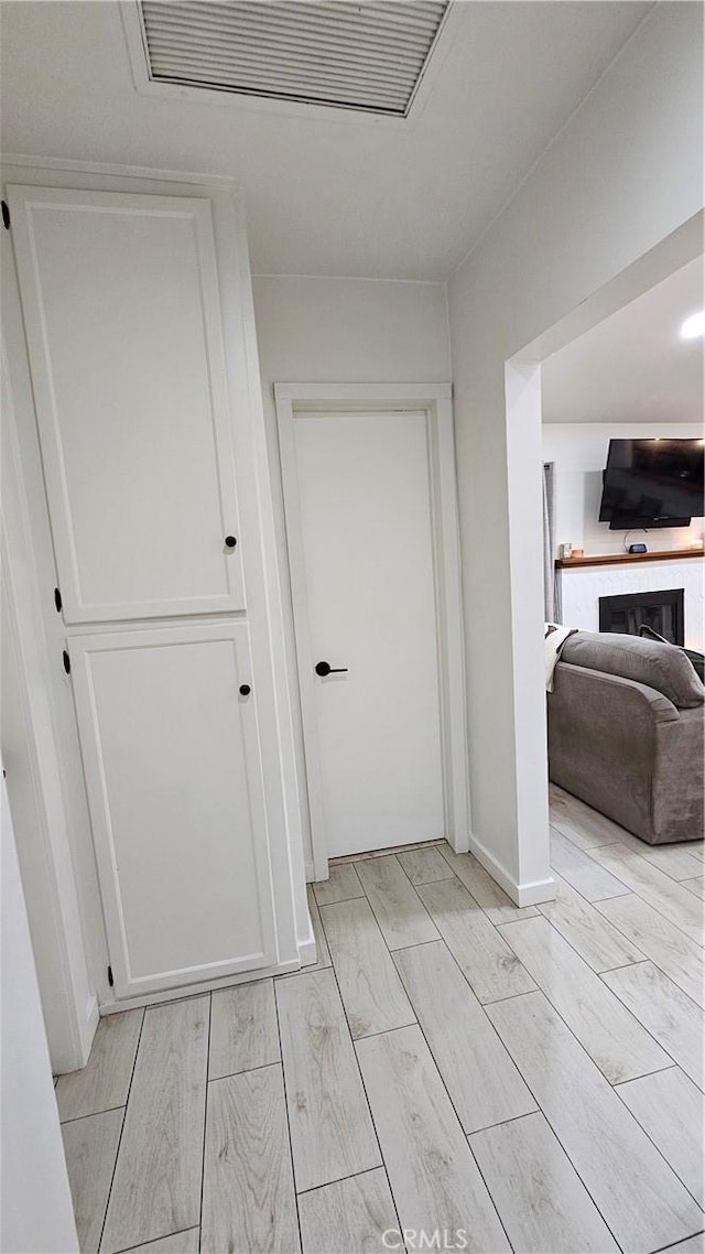 402 Hartzell Ave, Redlands, CA 92374 - corridor with light wood-style floors