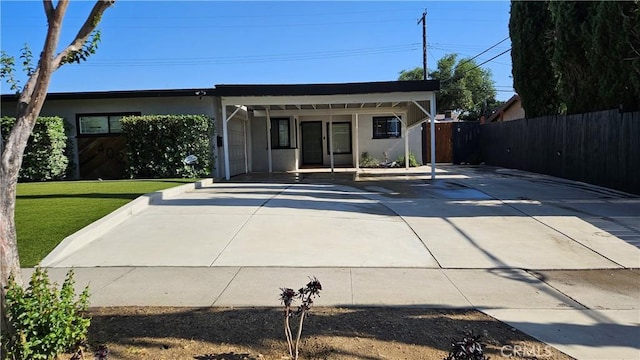 402 Hartzell Ave, Redlands, CA 92374 - view of front of property with driveway, stucco siding, and an attached carport
