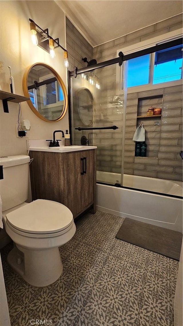 402 Hartzell Ave, Redlands, CA 92374 - bathroom featuring toilet, vanity, and bath / shower combo with glass door
