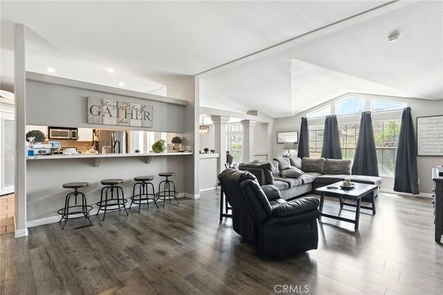 3595 Buchanan St, Riverside, CA 92503 - living area featuring ornate columns, recessed lighting, dark wood-style floors, baseboards, and vaulted ceiling