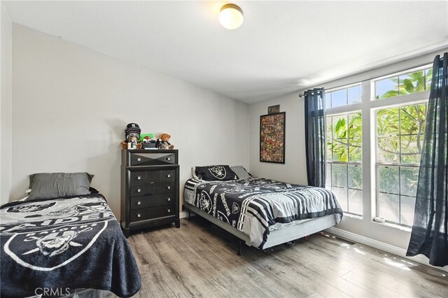 3595 Buchanan St, Riverside, CA 92503 - bedroom with wood finished floors and baseboards