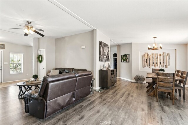 3595 Buchanan St, Riverside, CA 92503 - living area featuring wood finished floors, a chandelier, baseboards, and a ceiling fan