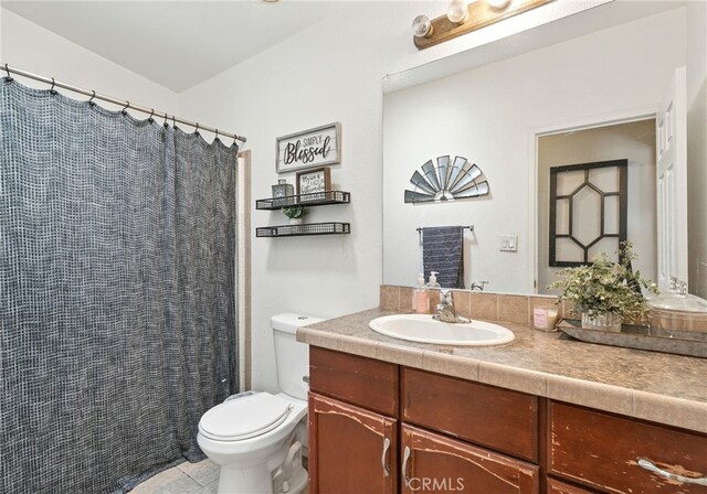 3595 Buchanan St, Riverside, CA 92503 - bathroom featuring toilet, vanity, tile patterned floors, and a shower with shower curtain