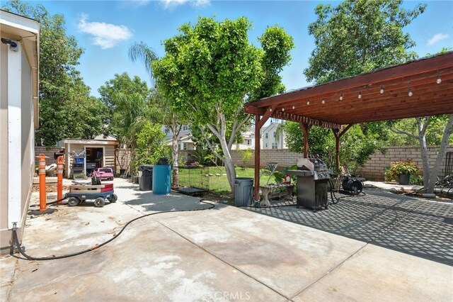 3595 Buchanan St, Riverside, CA 92503 - view of patio with area for grilling and a pergola