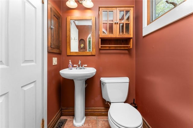 337 S Center St, Redlands, CA 92373 - bathroom with toilet, baseboards, tile patterned flooring, and a sink