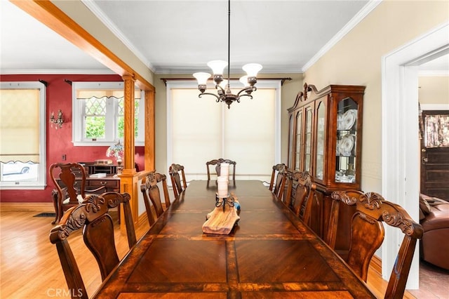 337 S Center St, Redlands, CA 92373 - dining space with a chandelier, crown molding, decorative columns, wood finished floors, and baseboards