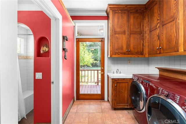 337 S Center St, Redlands, CA 92373 - laundry area with independent washer and dryer, cabinet space, light tile patterned flooring, ornamental molding, and baseboards