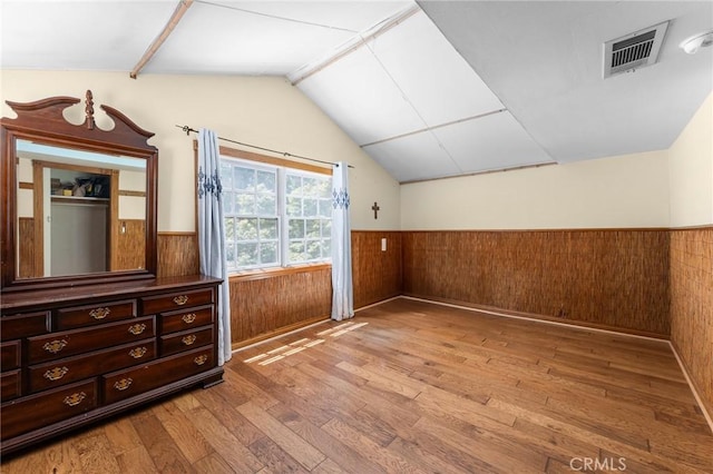 337 S Center St, Redlands, CA 92373 - bonus room featuring wainscoting, vaulted ceiling, light wood-style flooring, and wooden walls