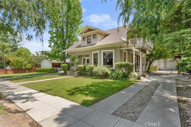 337 S Center St, Redlands, CA 92373 - bungalow-style home with a balcony, roof with shingles, and covered porch