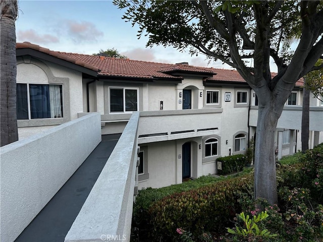 30902 Clubhouse Dr Unit 27H, Laguna Niguel, CA 92677 - view of front of house featuring stucco siding and a tiled roof