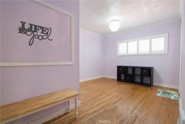 1247 W 17th St, San Pedro, CA 90731 - spare room featuring hardwood / wood-style flooring, ornamental molding, baseboards, and a chandelier