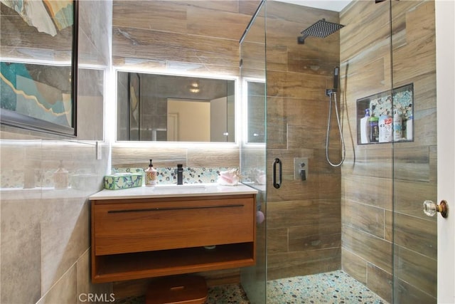 1247 W 17th St, San Pedro, CA 90731 - bathroom featuring a stall shower, vanity, and tile walls