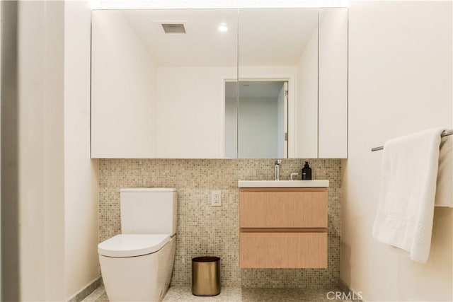 877 Francisco St Unit 1512, Los Angeles, CA 90017 - bathroom featuring vanity and backsplash
