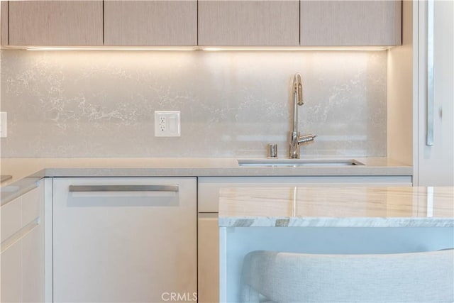 877 Francisco St Unit 1512, Los Angeles, CA 90017 - kitchen with white dishwasher, light countertops, backsplash, and white cabinetry