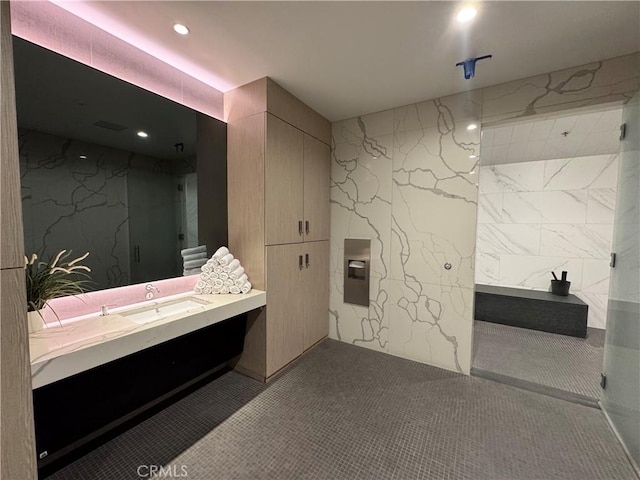 877 Francisco St Unit 1512, Los Angeles, CA 90017 - bathroom with vanity, a marble finish shower, and recessed lighting