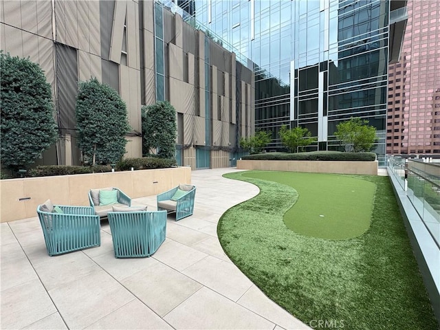 877 Francisco St Unit 1512, Los Angeles, CA 90017 - view of property's community featuring an area to practice putting, a patio, and an outdoor living space