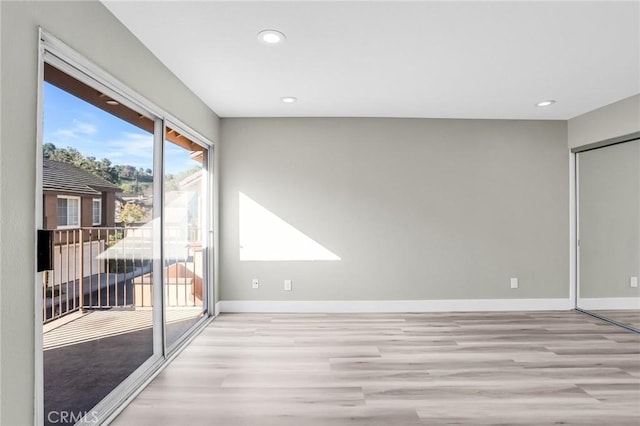 8039 E Snapdragon Ln, Anaheim, CA 92808 - unfurnished room with wood finished floors, baseboards, and recessed lighting