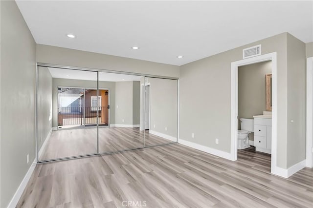 8039 E Snapdragon Ln, Anaheim, CA 92808 - unfurnished bedroom with light wood finished floors, baseboards, a closet, and recessed lighting