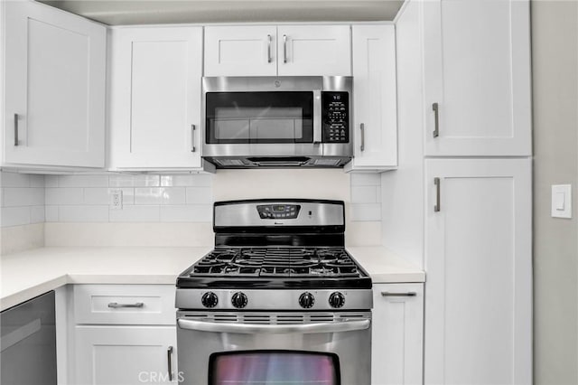 8039 E Snapdragon Ln, Anaheim, CA 92808 - kitchen featuring stainless steel appliances, white cabinets, and backsplash