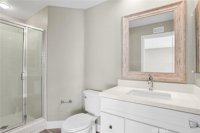 8039 E Snapdragon Ln, Anaheim, CA 92808 - bathroom featuring toilet, vanity, a stall shower, and baseboards