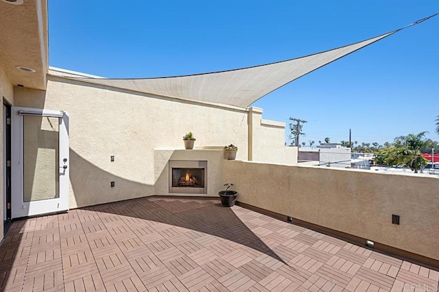 1135 Felspar St, Pacific Beach San Diego, CA 92109 - view of patio / terrace with a warm lit fireplace