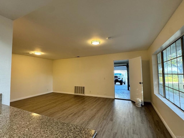 1103 Manzana Way, San Diego, CA 92139 - empty room featuring dark wood-style floors and a smoke detector