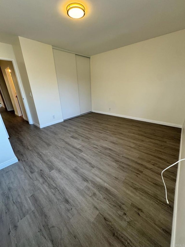1103 Manzana Way, San Diego, CA 92139 - unfurnished bedroom featuring dark wood-style flooring and a closet