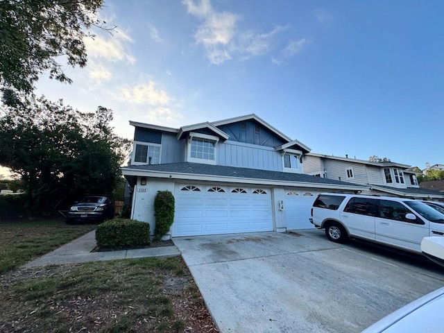 1103 Manzana Way, San Diego, CA 92139 - view of front of property featuring a garage, concrete driveway, and board and batten siding