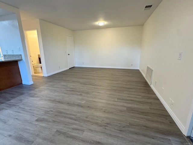 1103 Manzana Way, San Diego, CA 92139 - unfurnished living room with baseboards and wood finished floors